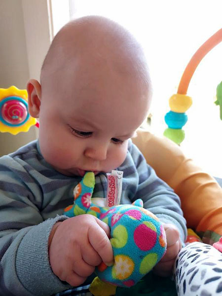 Infant with toy