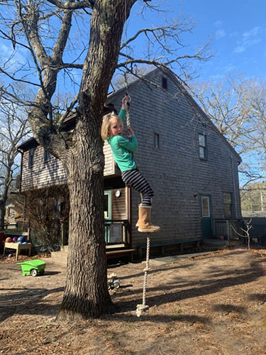 girl on a rope swing