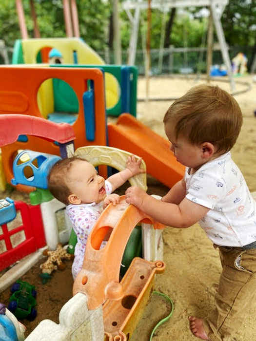 Infants in a sandbox